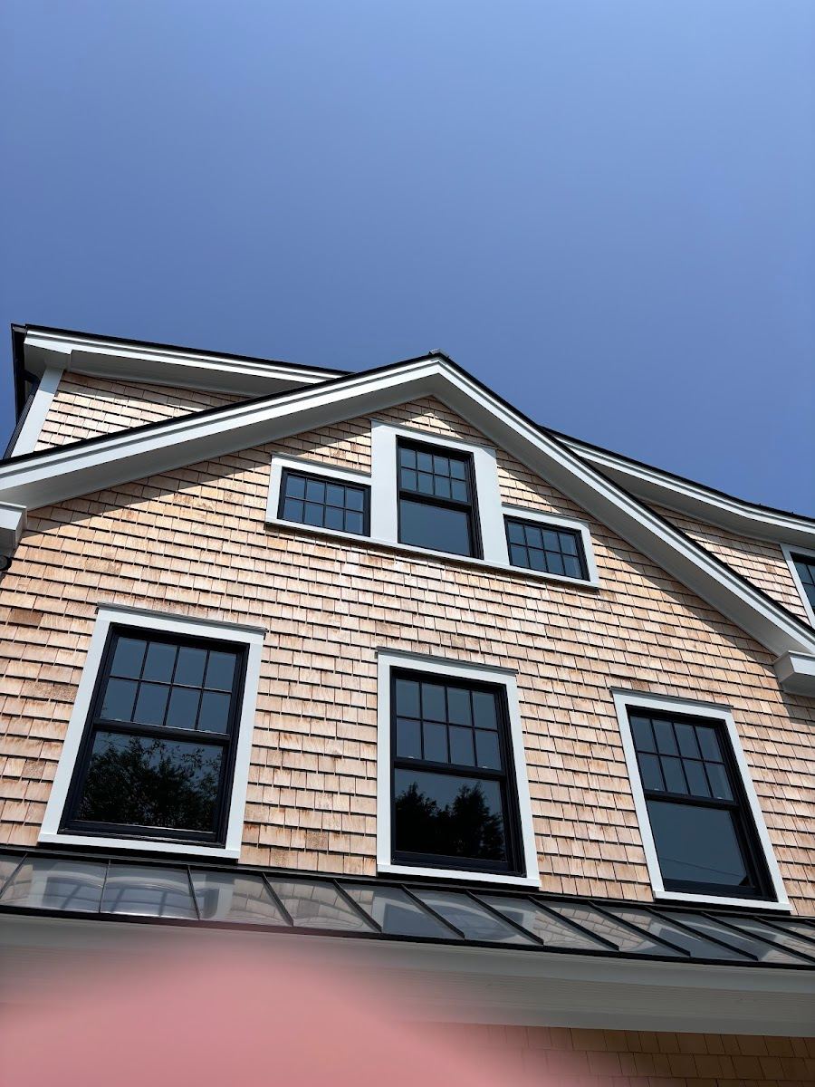 Wash Bros team cleaning a Massachusetts home exterior
