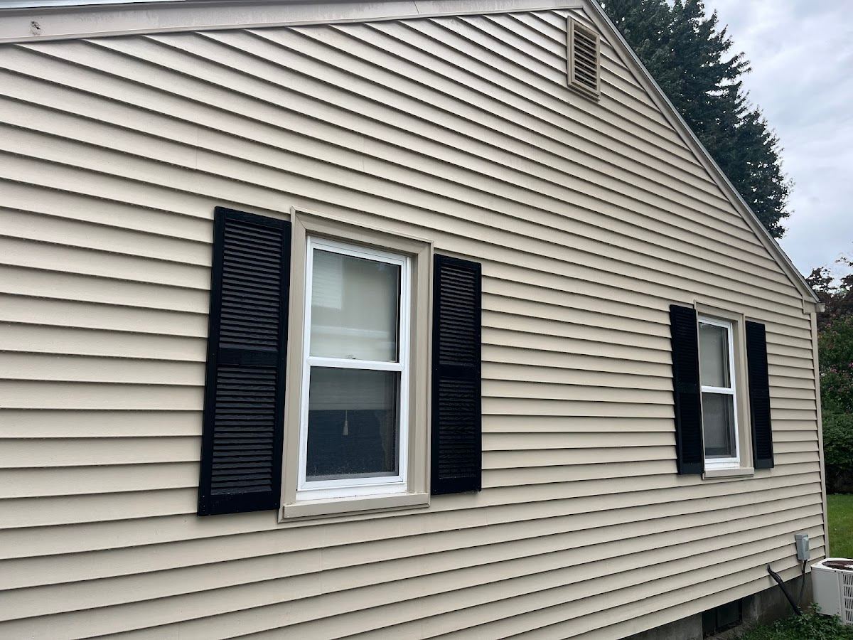 Fence and siding cleaning close-up in Massachusetts